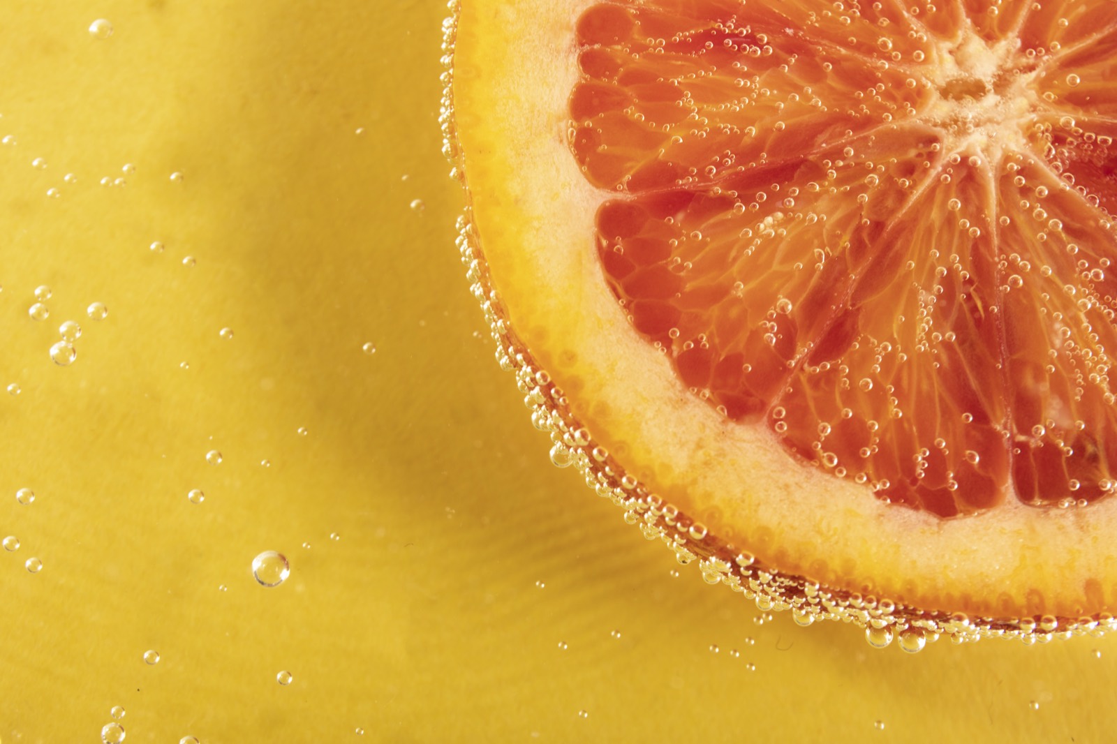 Grapefruit slice in sparkling water